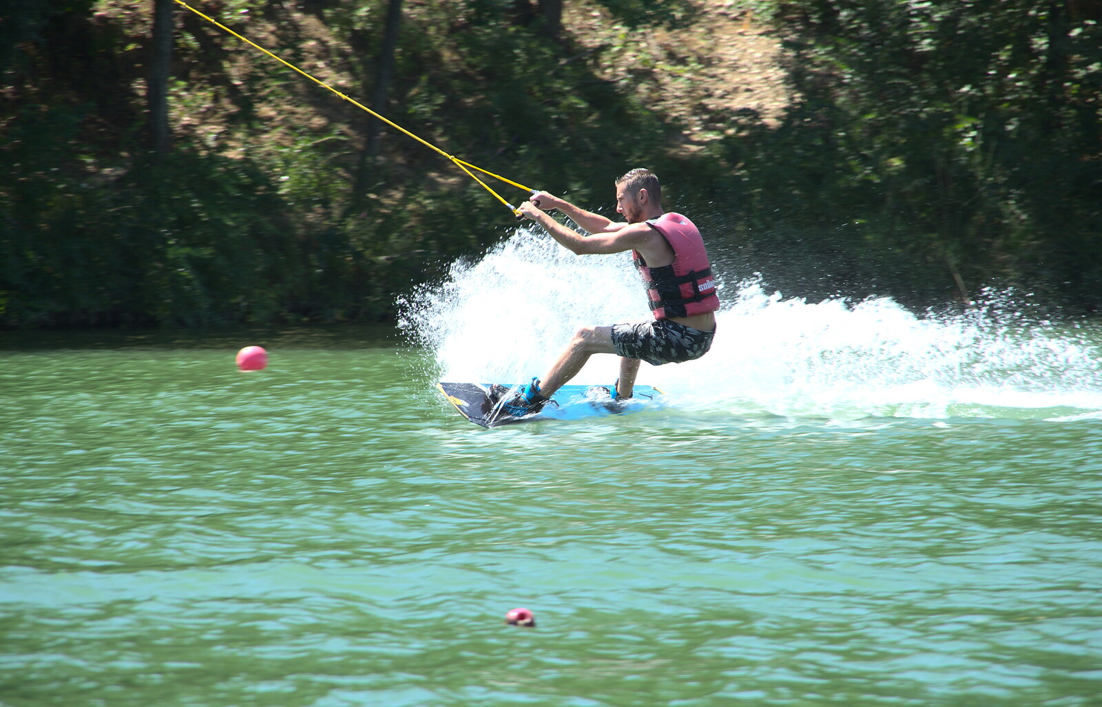 Some dude practices water-skiing from Abbaye Sainte-Marie de Lagrasse and The Lac de la Cavayère, Aude, France - 10th August