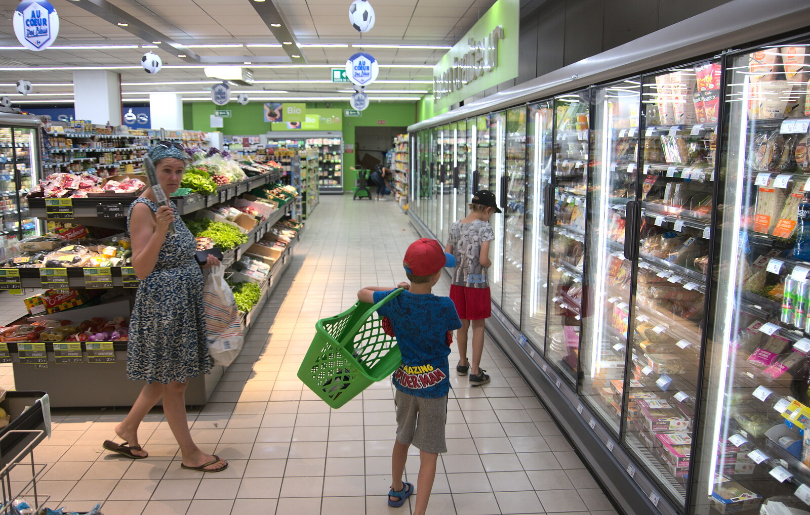 Isobel roams around with a cucumber in Carrefour  from Abbaye Sainte-Marie de Lagrasse and The Lac de la Cavayère, Aude, France - 10th August