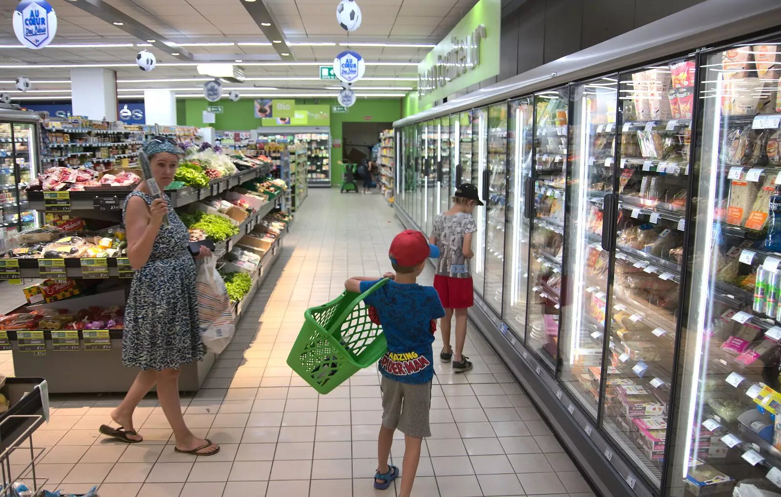 Isobel roams around with a cucumber in Carrefour , from Abbaye Sainte-Marie de Lagrasse and The Lac de la Cavayère, Aude, France - 10th August