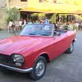 There's a Peugeot 204 convertible in the square, Abbaye Sainte-Marie de Lagrasse and The Lac de la Cavayère, Aude, France - 10th August