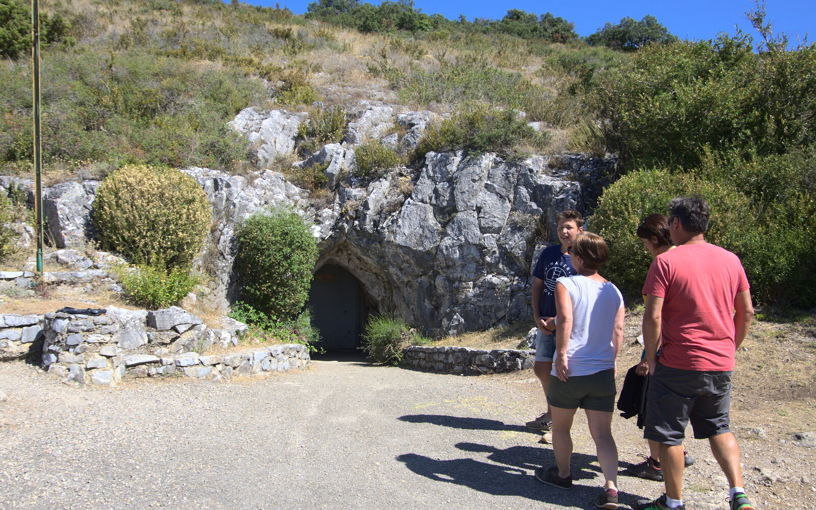 The tour group assembles by a small door to the cave from Le Gouffre Géant and Grotte de Limousis, Petanque and a Lightning Storm, Languedoc, France - 12th August 2018