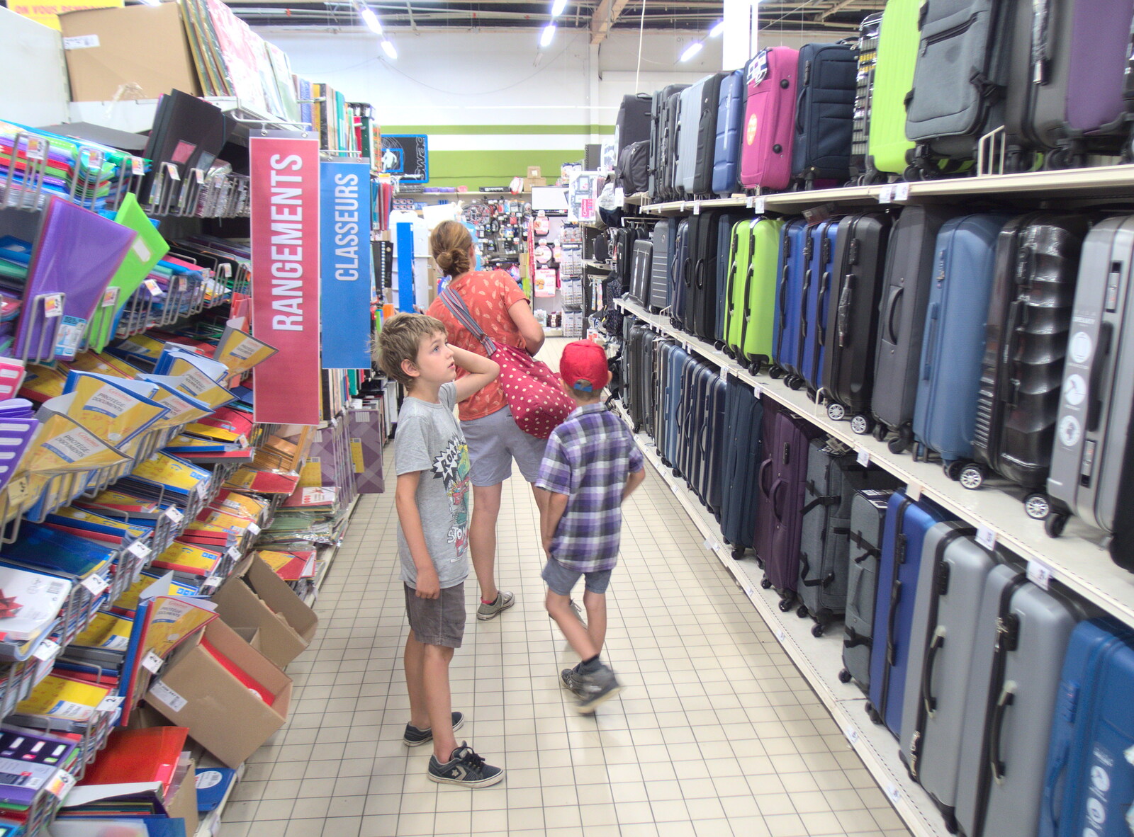 Isobel looks for luggage in Casino hypermarché from The Château Comtal, Lastours and the Journey Home, Carcassonne, Aude, France - 14th August 2018