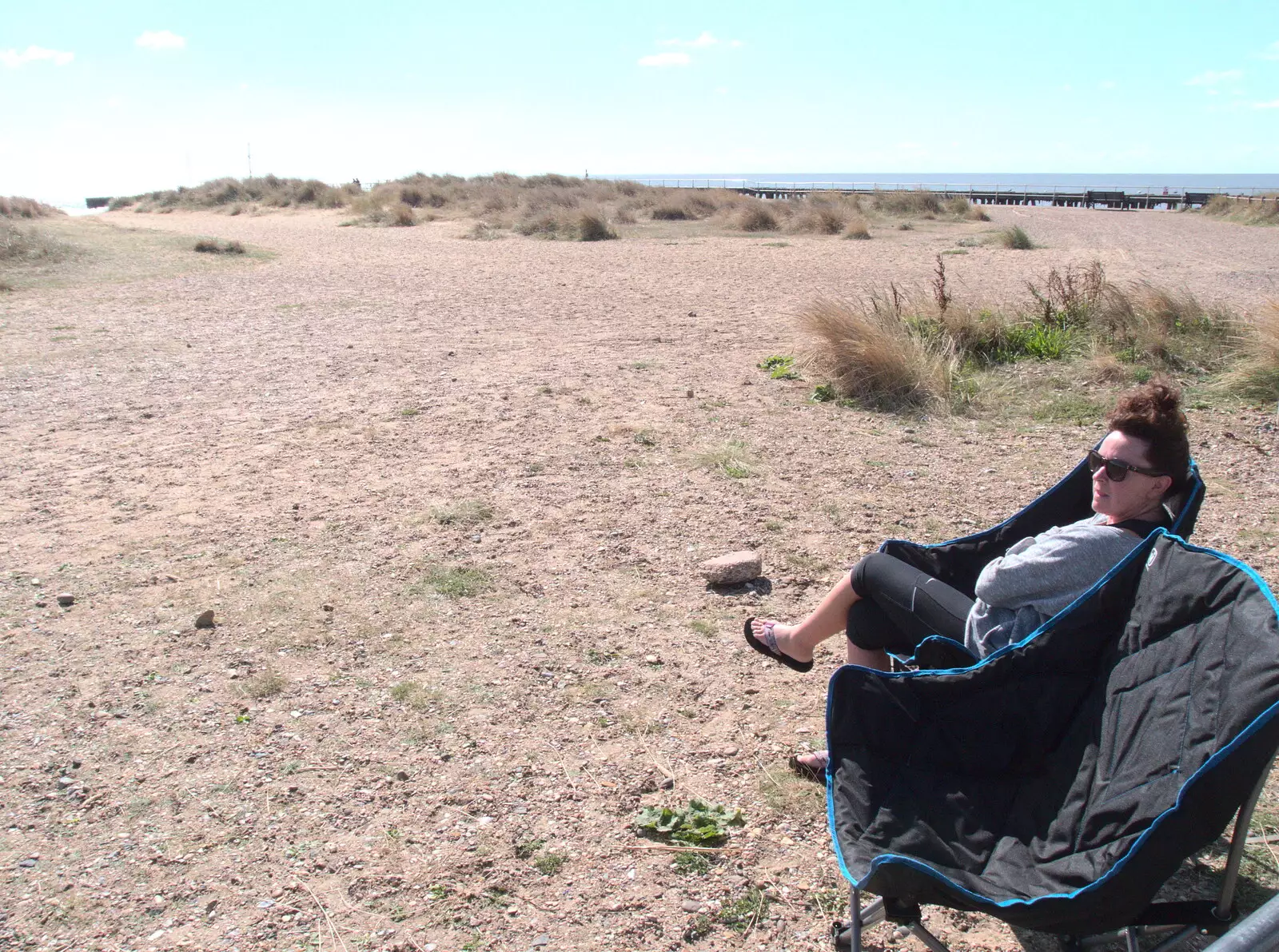 Evelyn takes a seat, from A Day on the Beach, Southwold, Suffolk - 25th August 2018