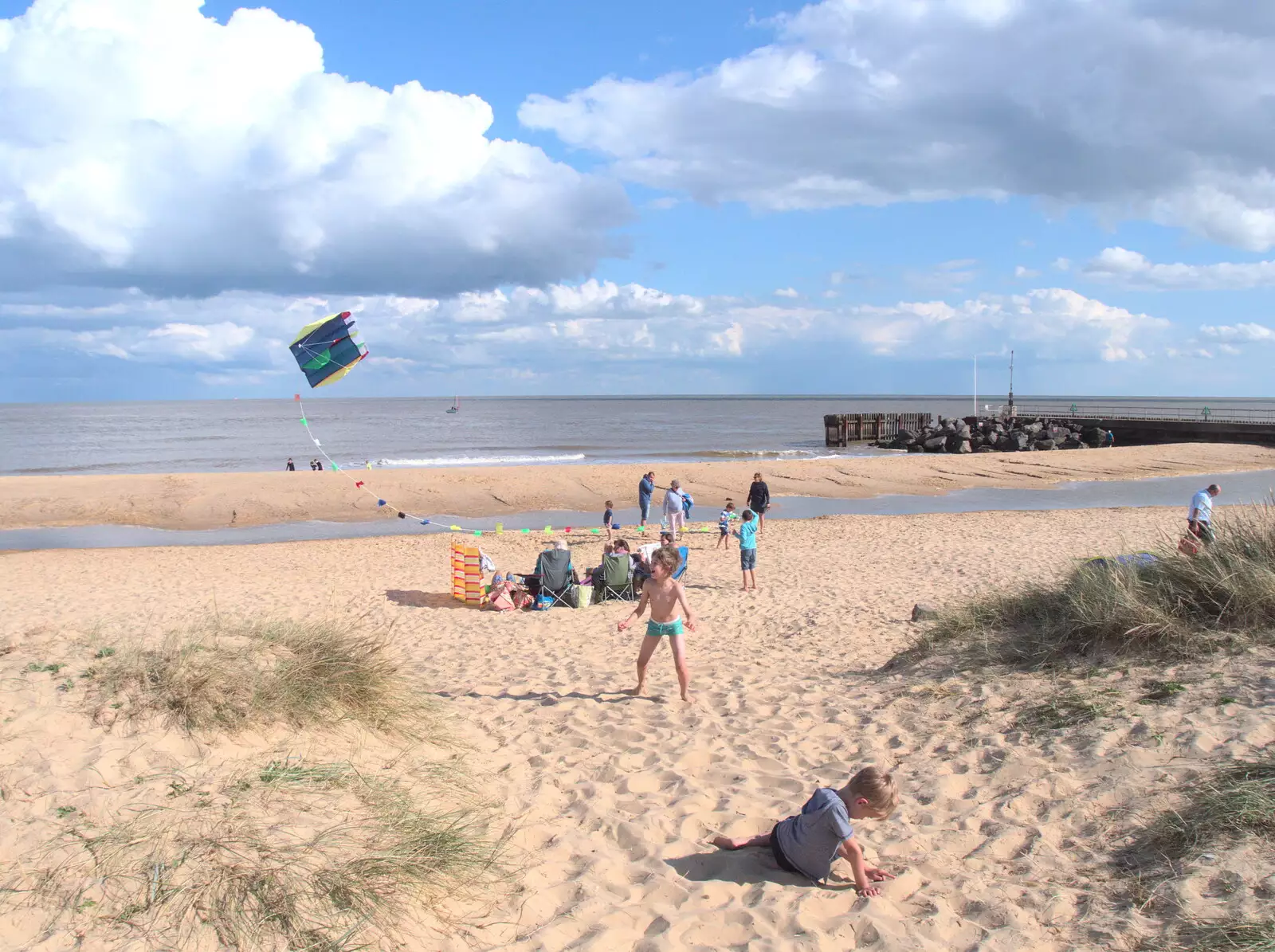 Fred watches the kite whirl around above him, from A Day on the Beach, Southwold, Suffolk - 25th August 2018