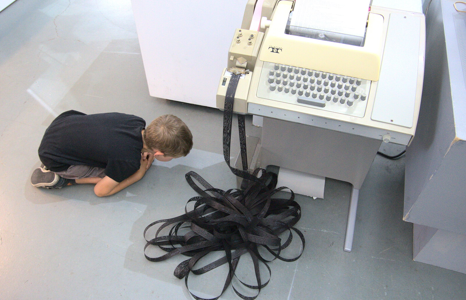 Fred is fascinated by a punched tape reader from The Retro Computer Festival, Centre For Computing History, Cambridge - 15th September 2018