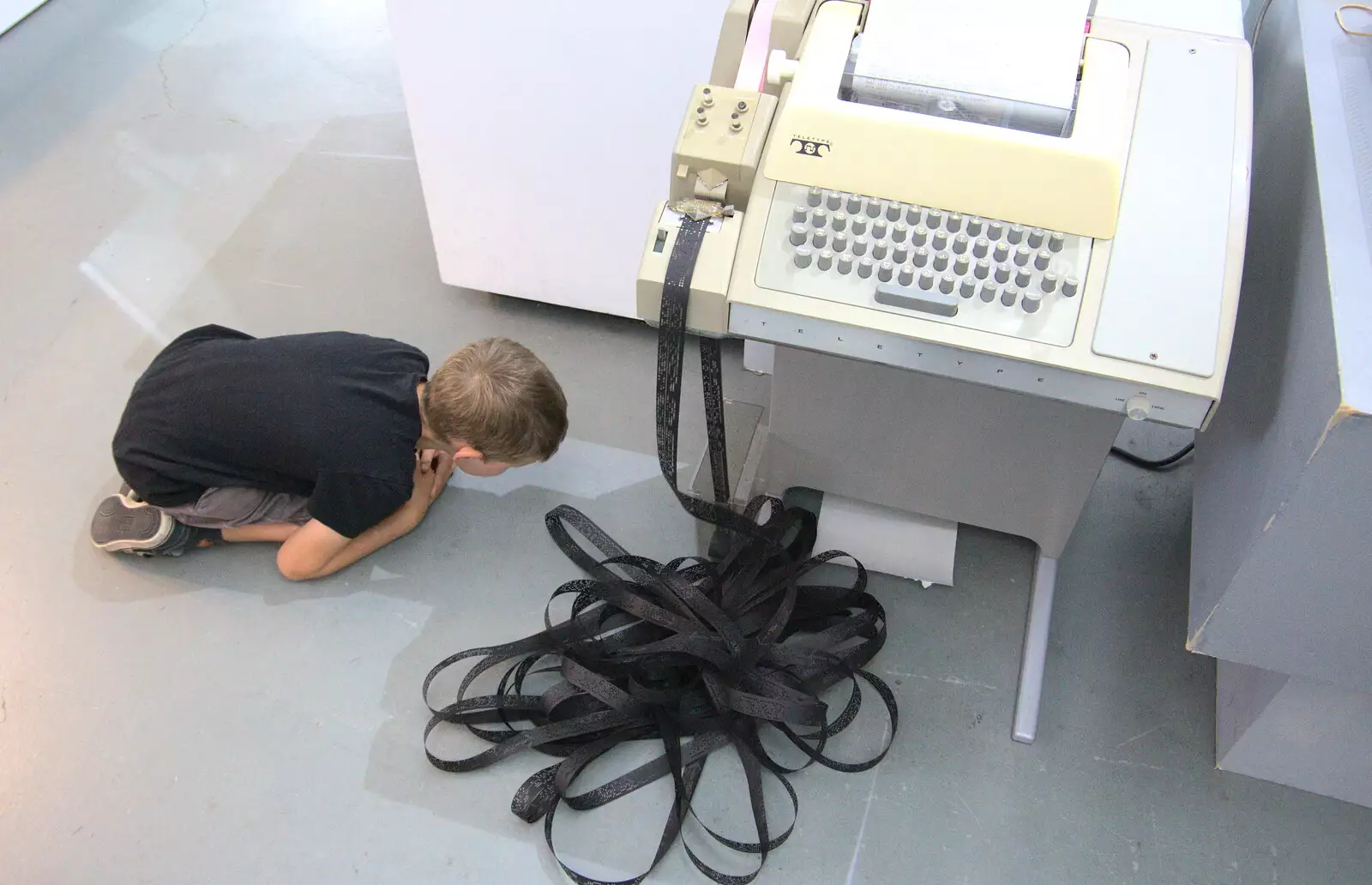 Fred is fascinated by a punched tape reader, from The Retro Computer Festival, Centre For Computing History, Cambridge - 15th September 2018