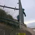 Fred hangs over a fence and watches the sea, An Optimistic Camping Weekend, Waxham Sands, Norfolk - 22nd September 2018