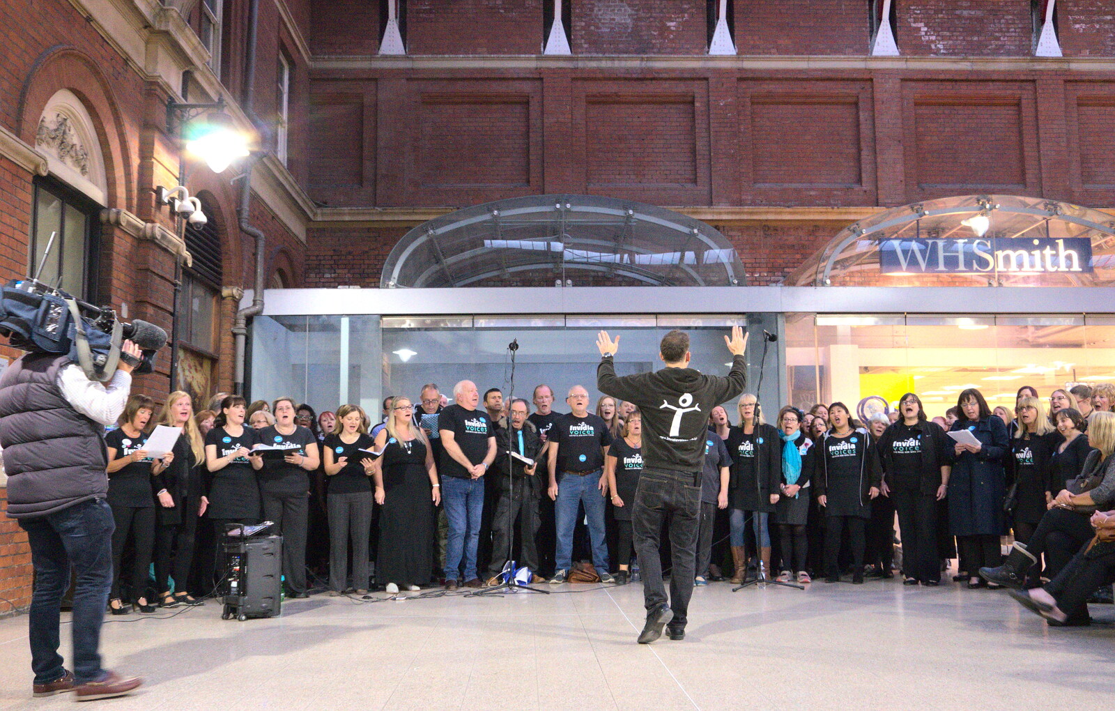 The conductor, er, conducts from Isobel and the Invidia Voices, Norwich Railway Station, Norfolk- 28th September 2018