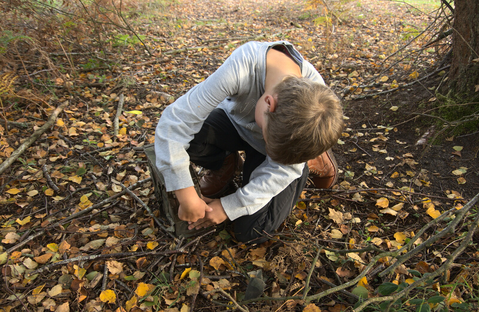 Fred opens the old ammo box from Evidence of Autumn: Geocaching on Knettishall Heath, Suffolk - 7th October 2018