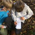 The boys read a listof messages, Evidence of Autumn: Geocaching on Knettishall Heath, Suffolk - 7th October 2018