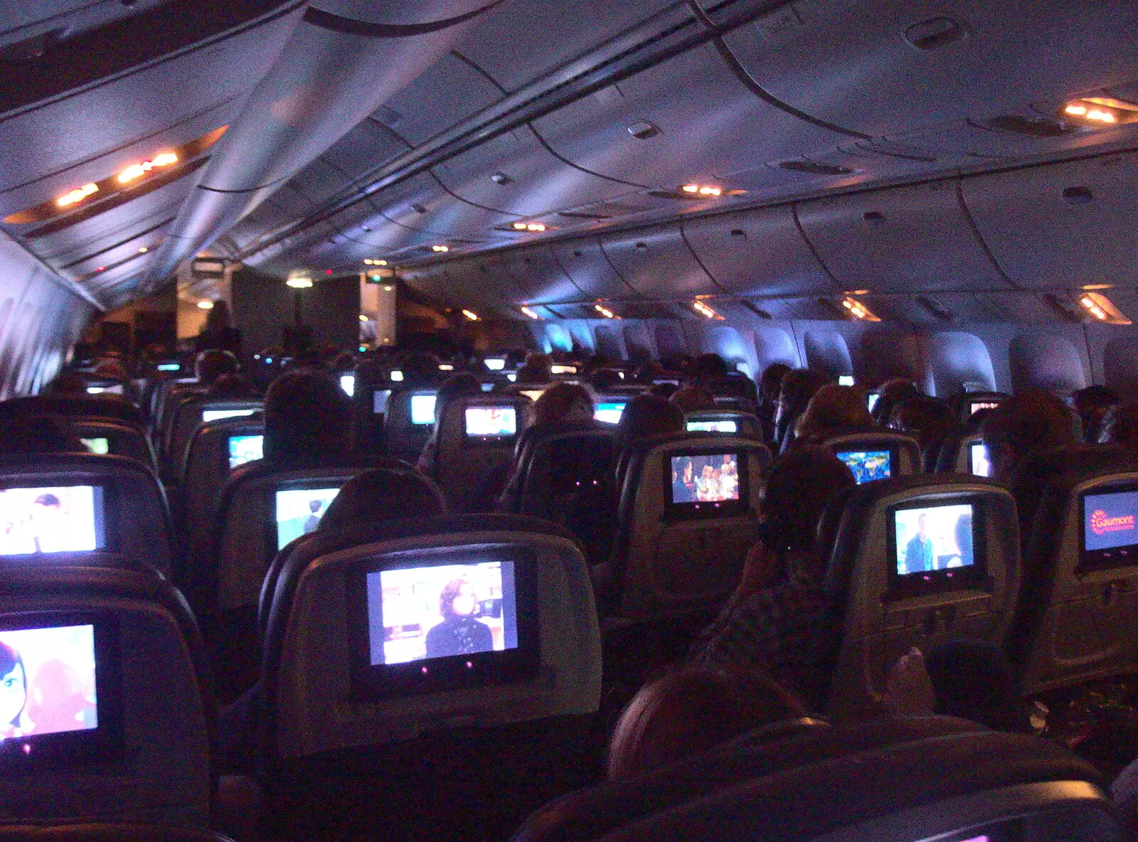 The cabin is a sea of seat-back screens in the dark, from A Trip to Short Hills, New Jersey, United States - 20th October 2018