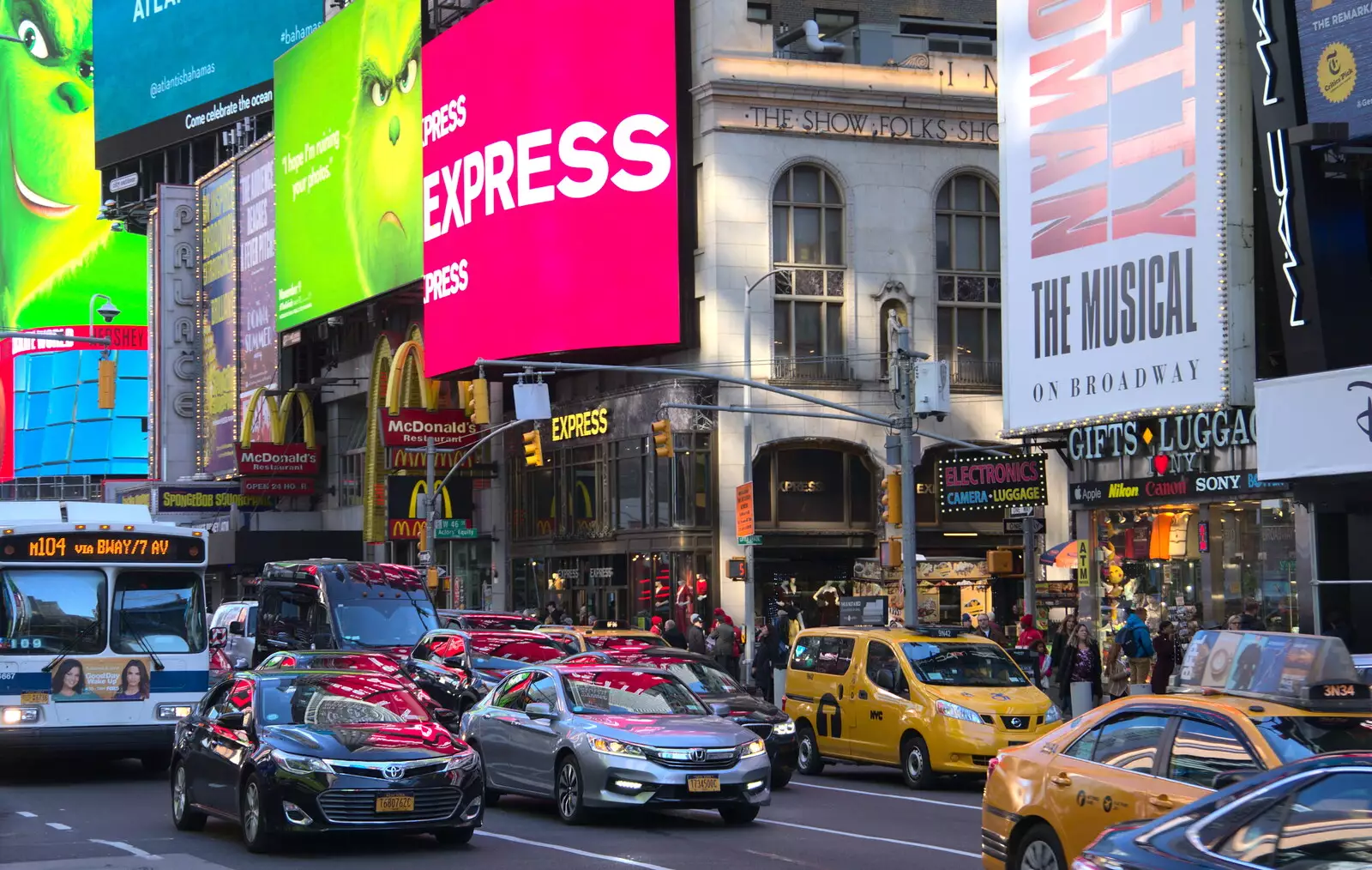 The signs are reflected in the cars below, from Times Square, USS Intrepid and the High Line, Manhattan, New York - 25th October 2018