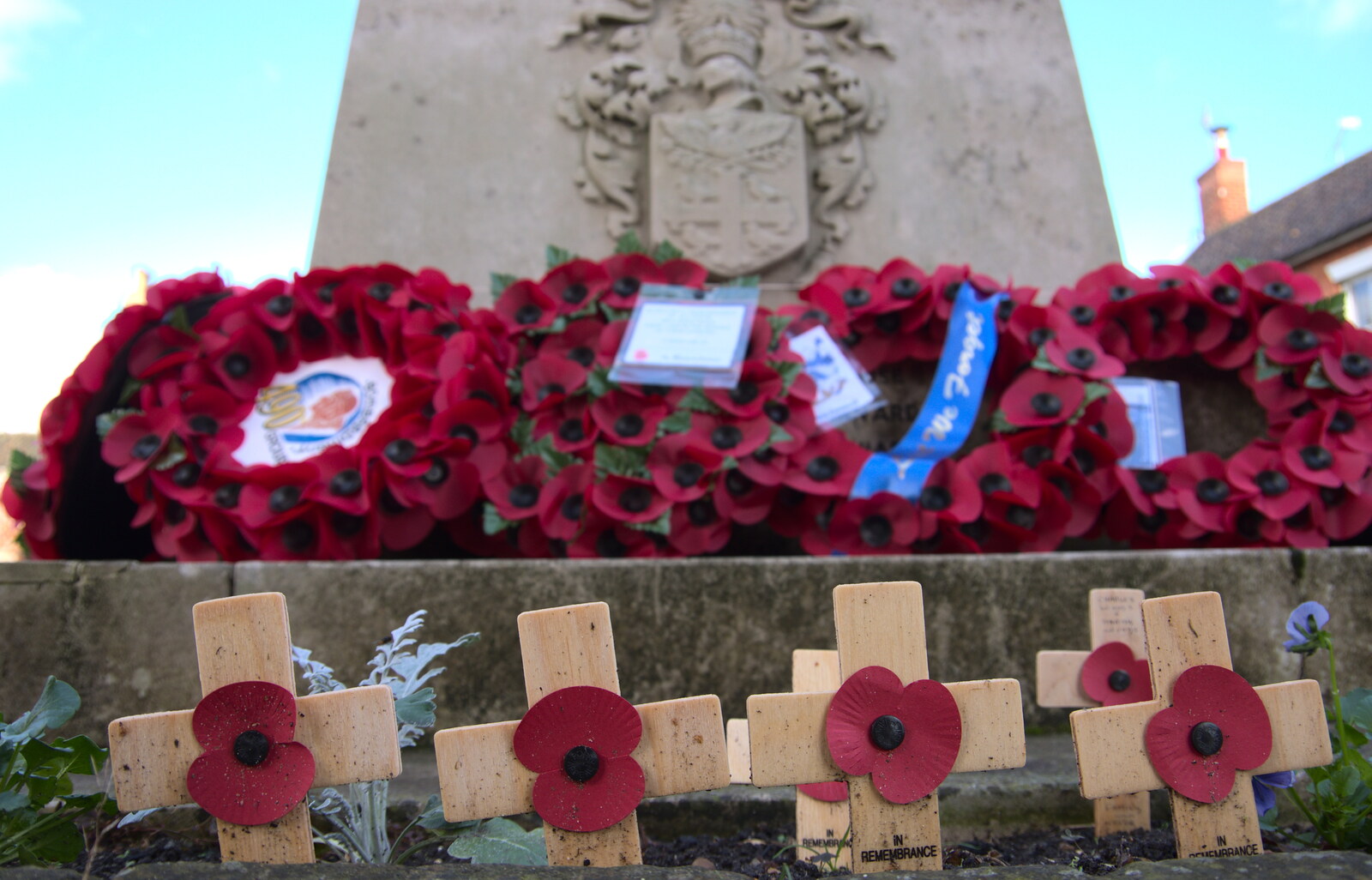 Wooden crosses and wreaths at the war memorial from The Remembrance Sunday Parade, Eye, Suffolk - 11th November 2018