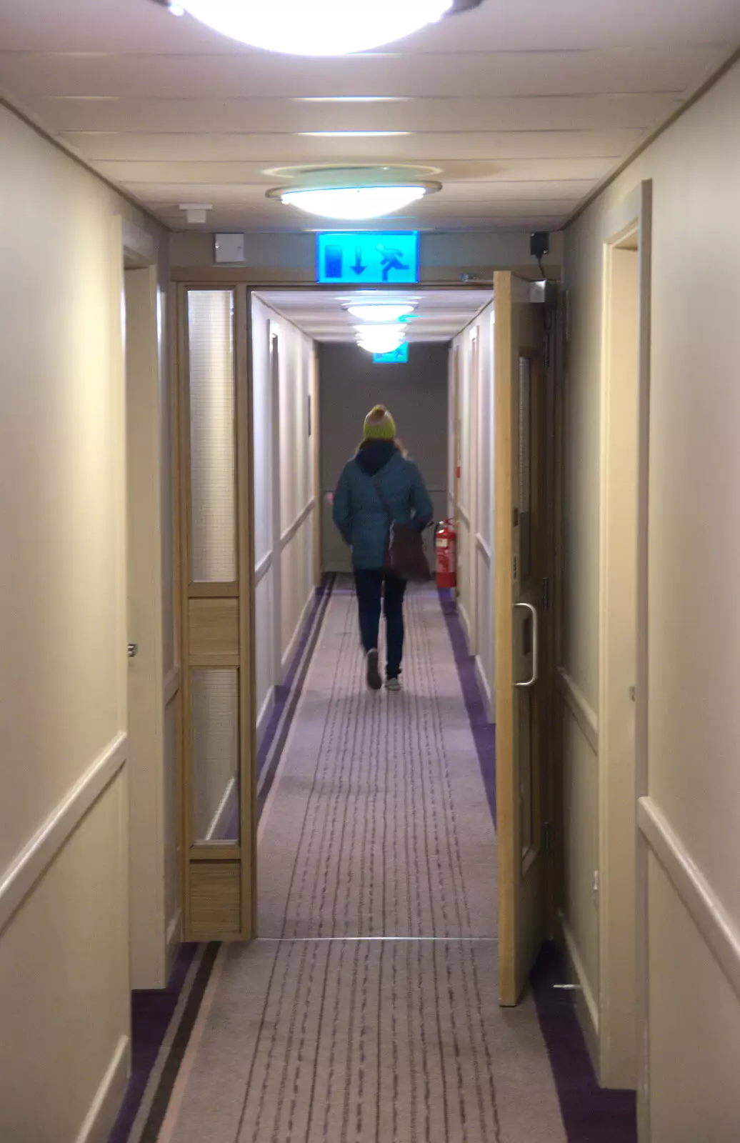 Isobel heads off down a hotel corridor, from Thanksgiving in Highcliffe, Dorset - 23rd November 2018