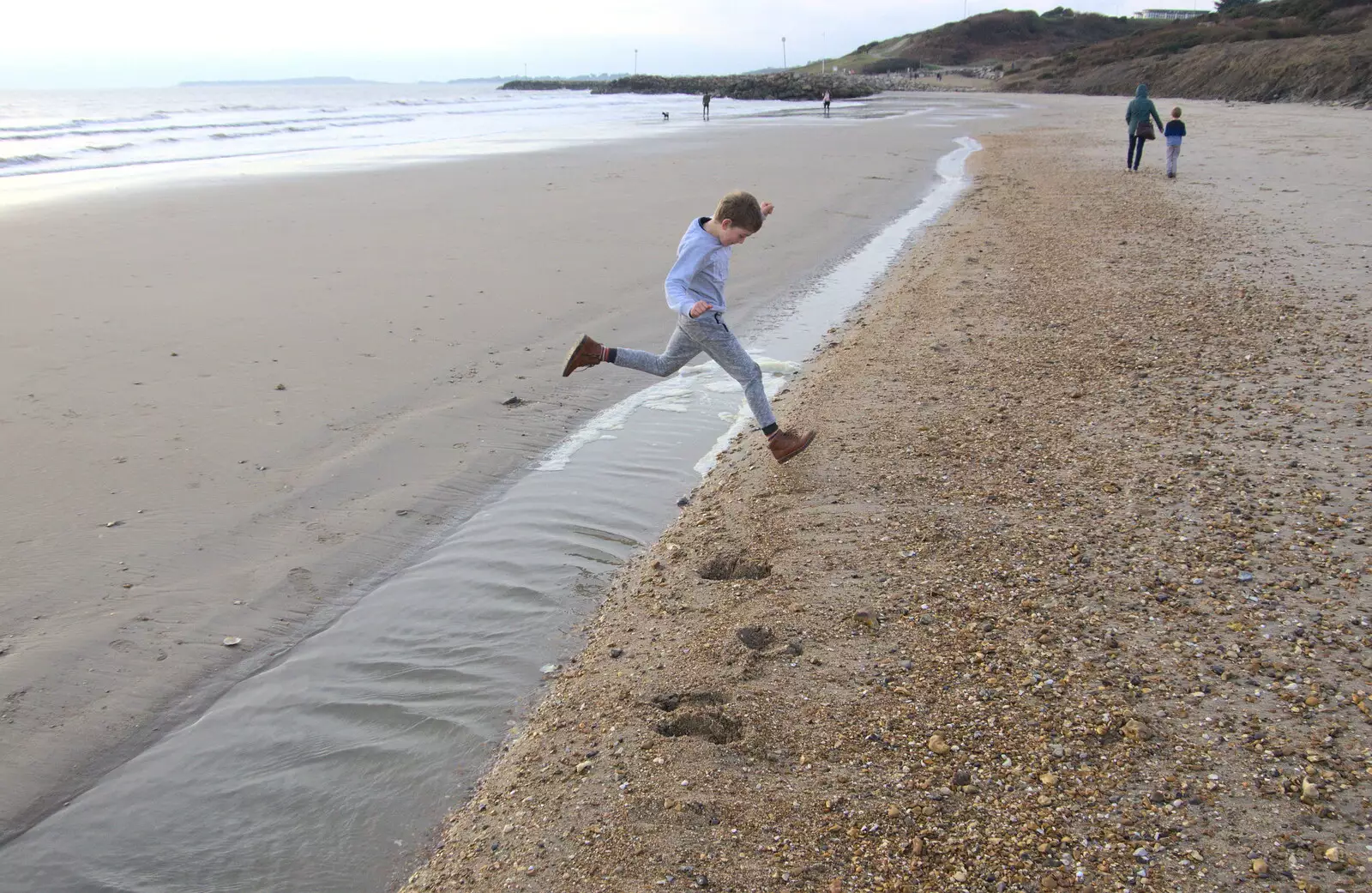 Fred leaps over a strip of water, from Thanksgiving in Highcliffe, Dorset - 23rd November 2018