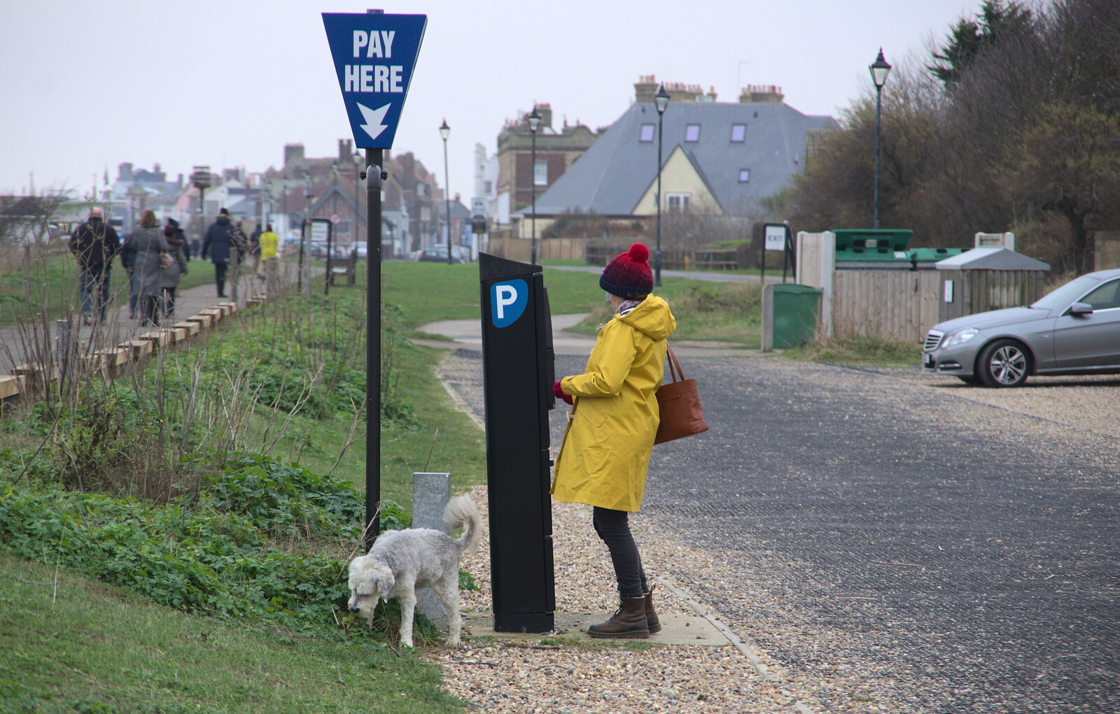 Isobel pays for parking as a dog cocks its leg from A Postcard from Aldeburgh, Suffolk - 6th January 2019