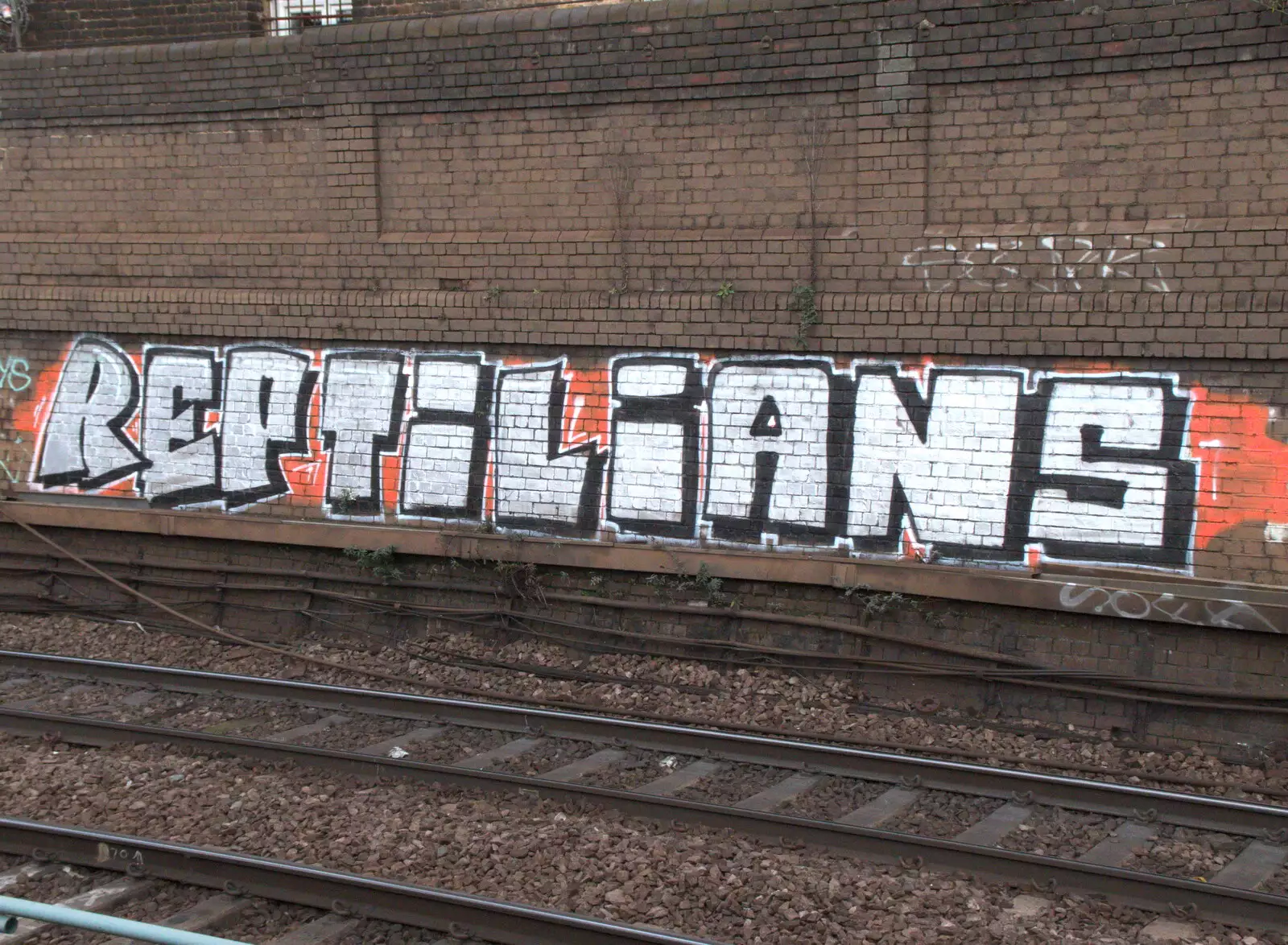 A big silver tag mysteriously says 'reptilians', from Railway Graffiti, Tower Hamlets, London - 12th February 2019