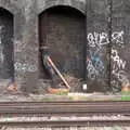 A pipe comes and goes through a brick arch, Railway Graffiti, Tower Hamlets, London - 12th February 2019