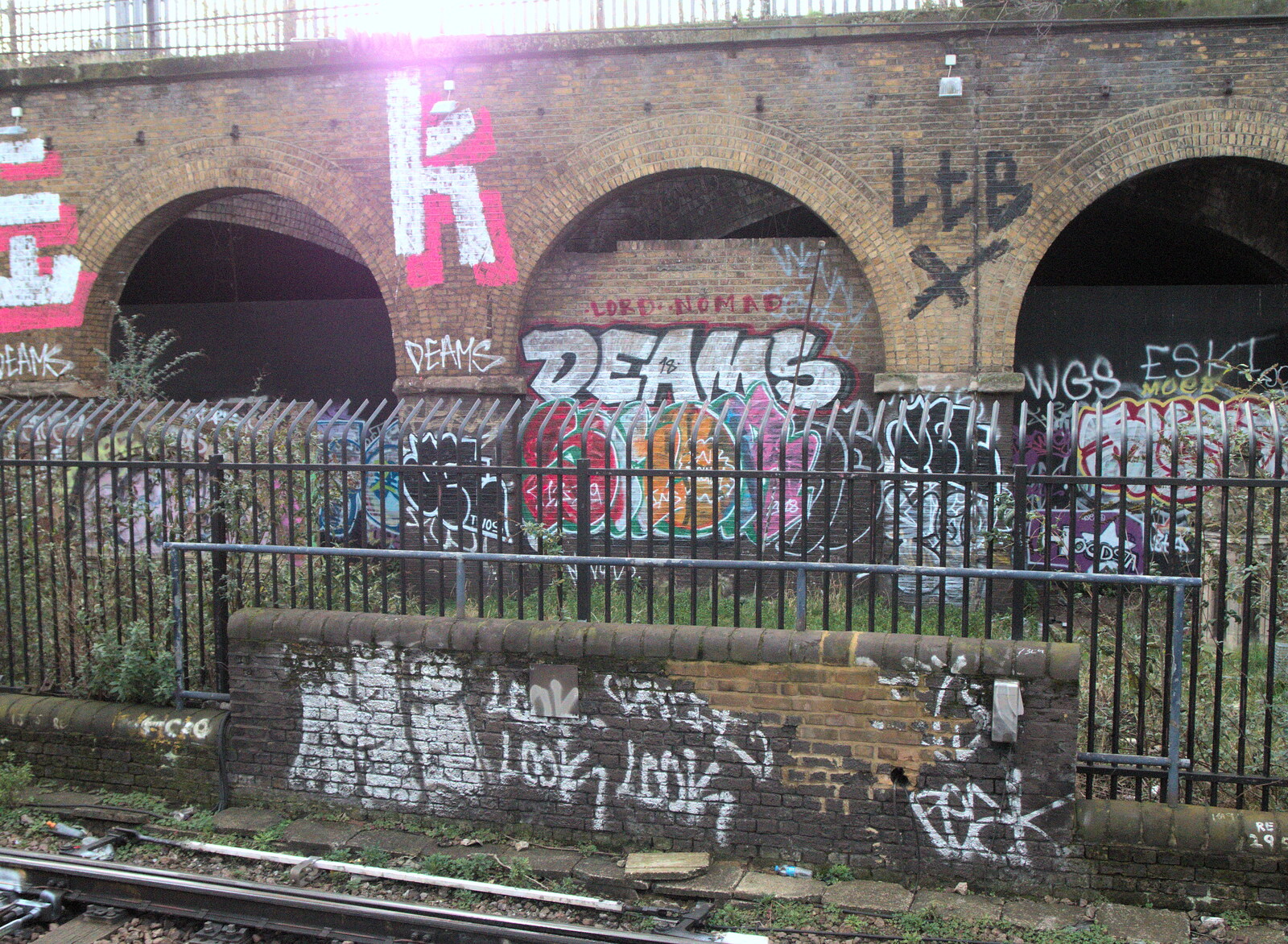 Lord Nomad and Deams tags are getting crowded out from Railway Graffiti, Tower Hamlets, London - 12th February 2019