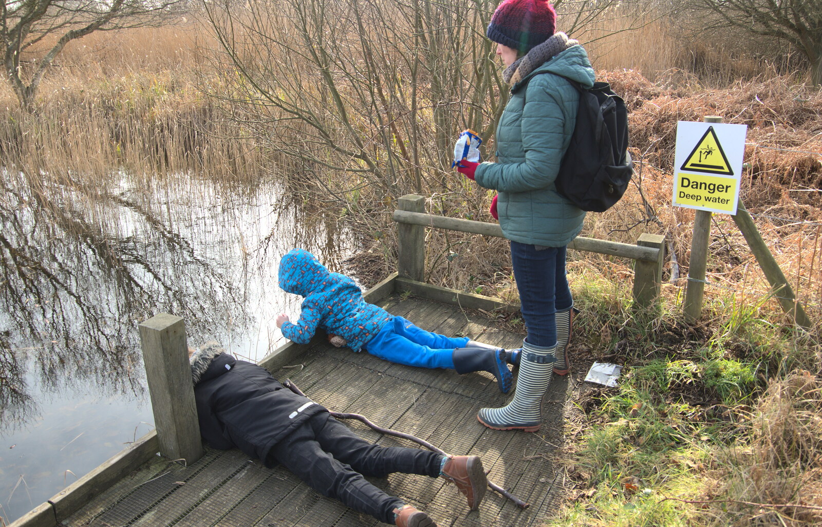 The boys look into the pond from A Trip to Dunwich Heath, Dunwich, Suffolk - 17th February 2019