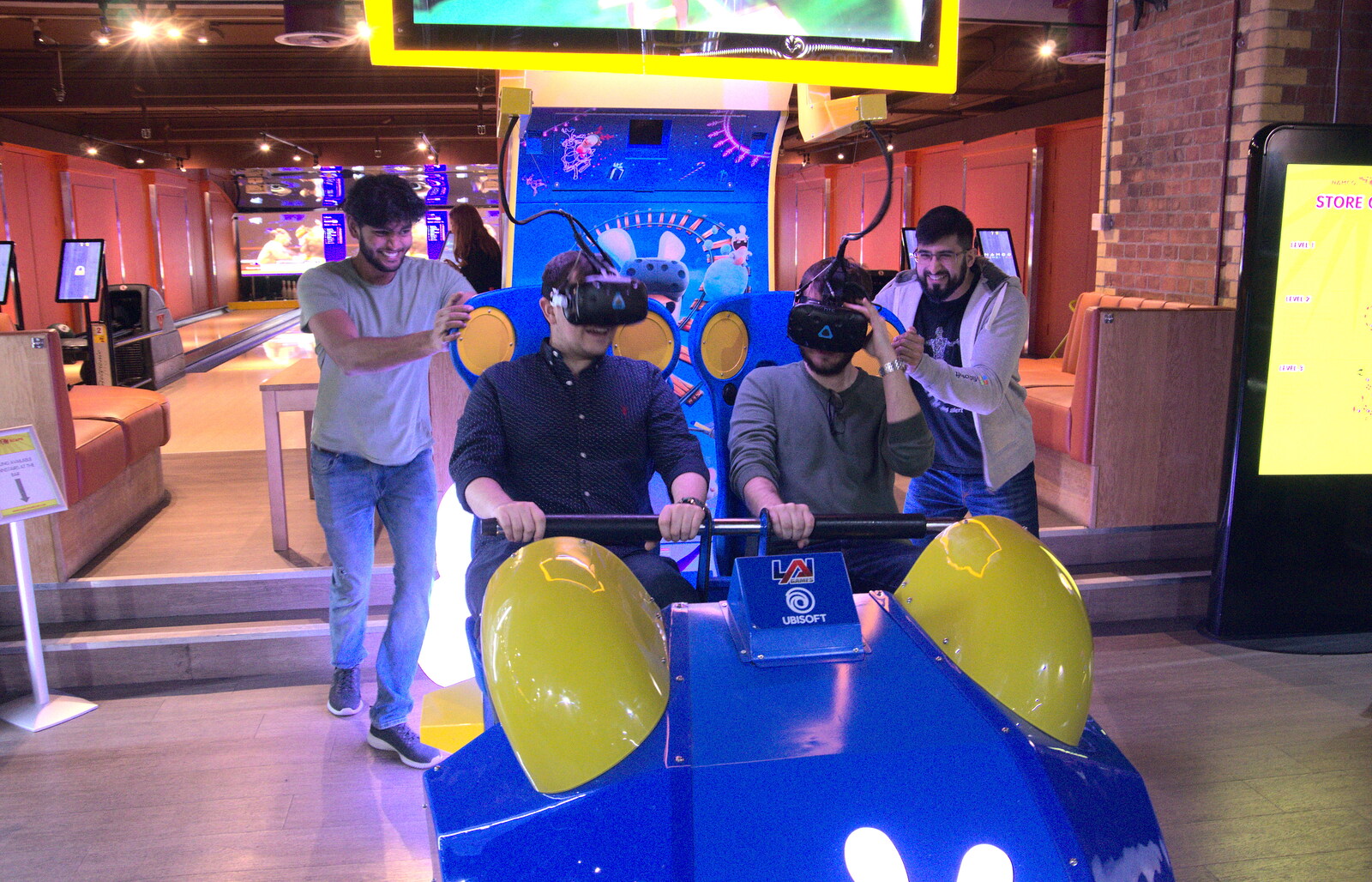 Praveen and Tehmur 'help' out on a VR thing from A Team Outing at Namco Funscape, South Bank, London - 27th March 2019