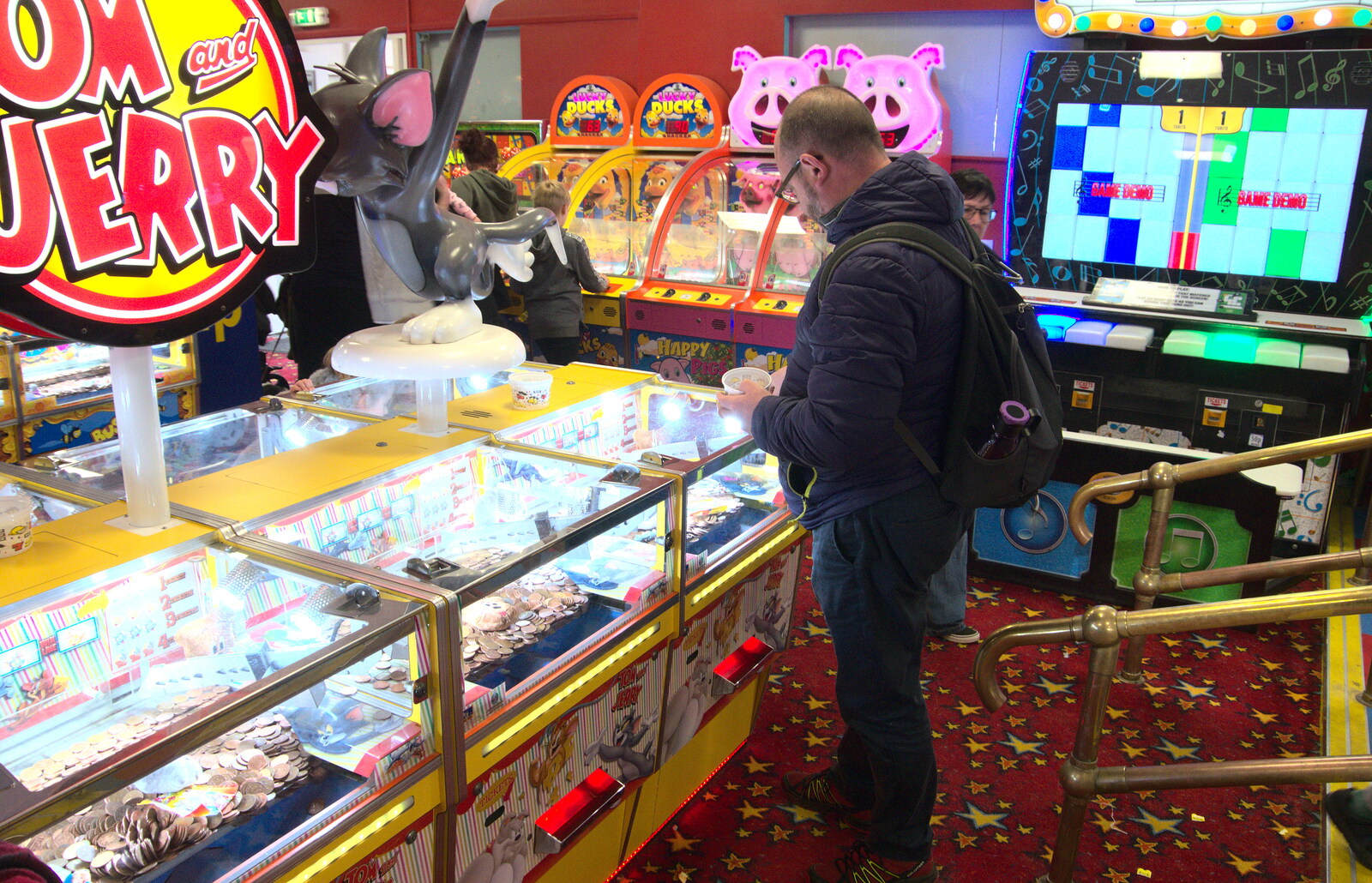 Matt has a go with the 2p machines from On The Beach, Southwold, Suffolk - 7th April 2019