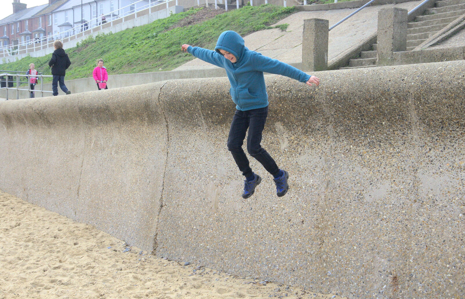 Fred leaps off the promenade from On The Beach, Southwold, Suffolk - 7th April 2019