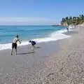 The boys hurl stones into the sea, A Holiday in Nerja, Andalusia, Spain - 15th April 2019