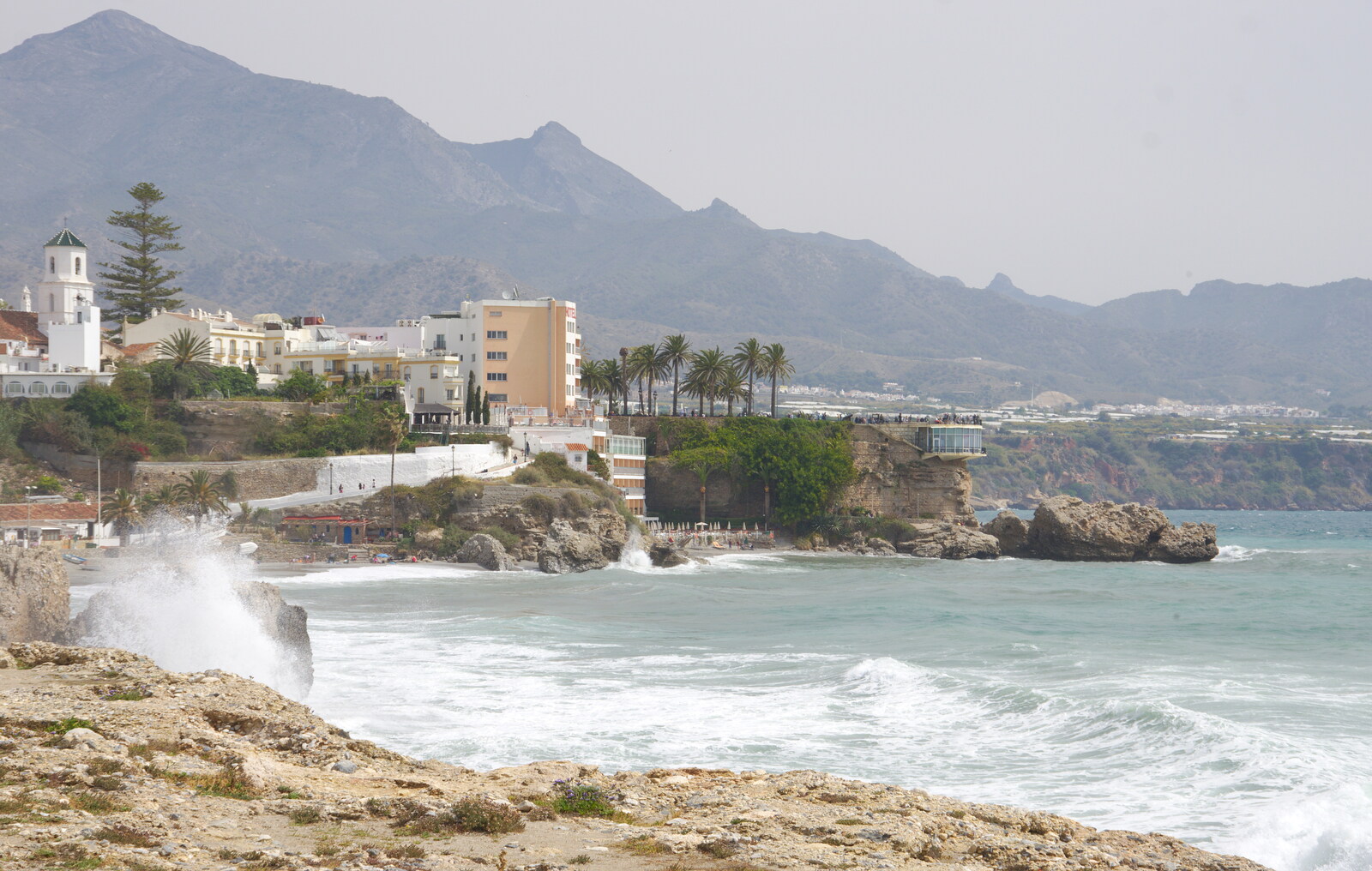 Waves crash on the rocks from Torrecilla Beach and the Nerja Museum, Andalusia, Spain - 17th April 2019
