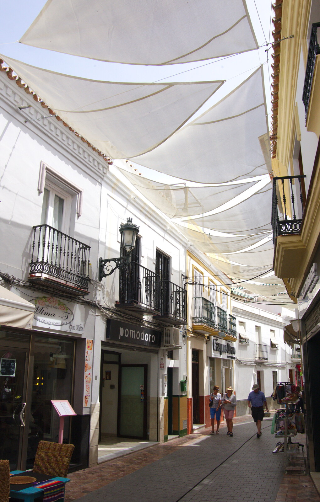 The blind-covered Calle El Barrio from Torrecilla Beach and the Nerja Museum, Andalusia, Spain - 17th April 2019