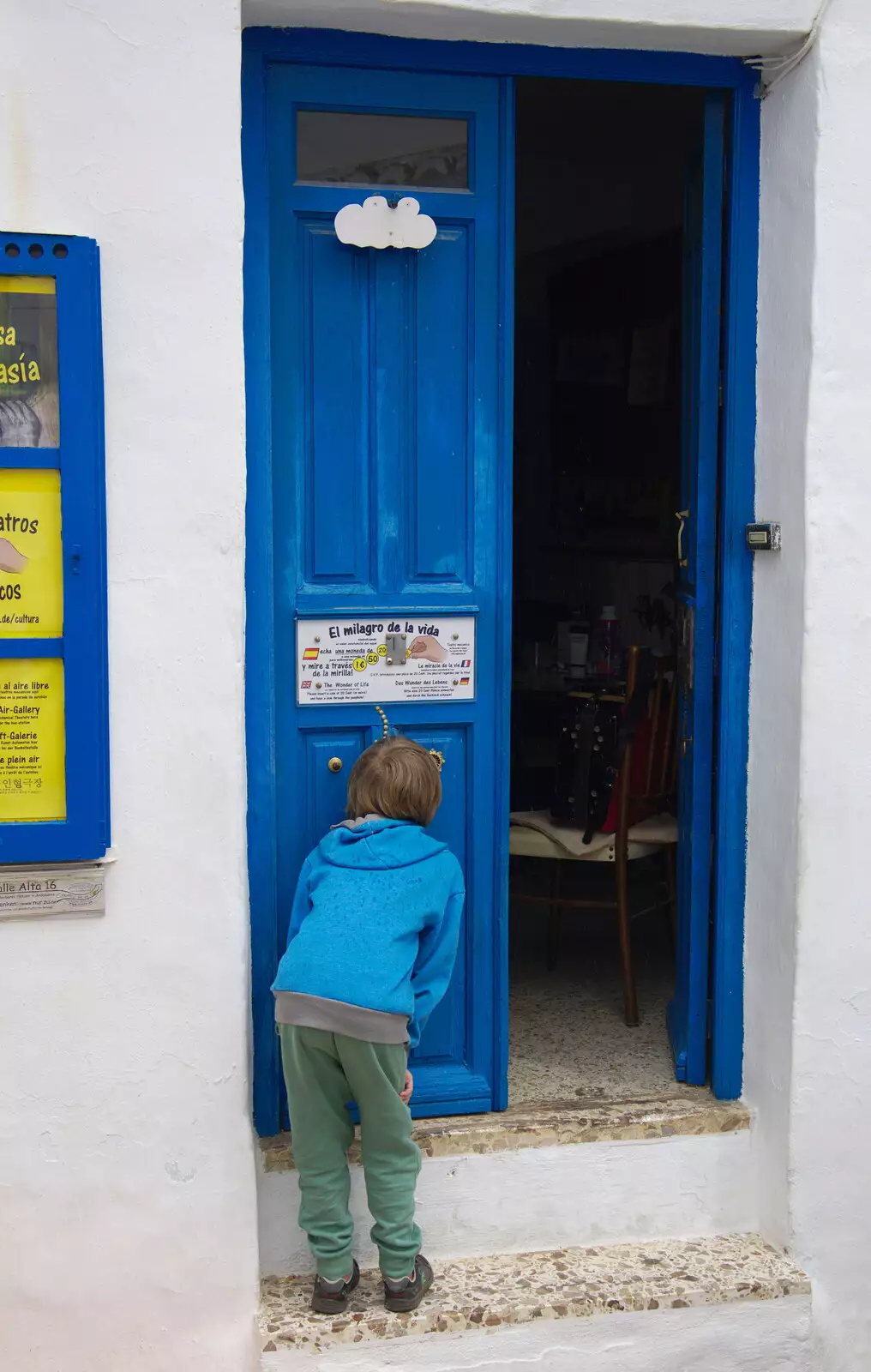 Harry watches a little theatrical peep-hole thing, from The Caves of Nerja, and Frigiliana, Andalusia, Spain - 18th April 2019