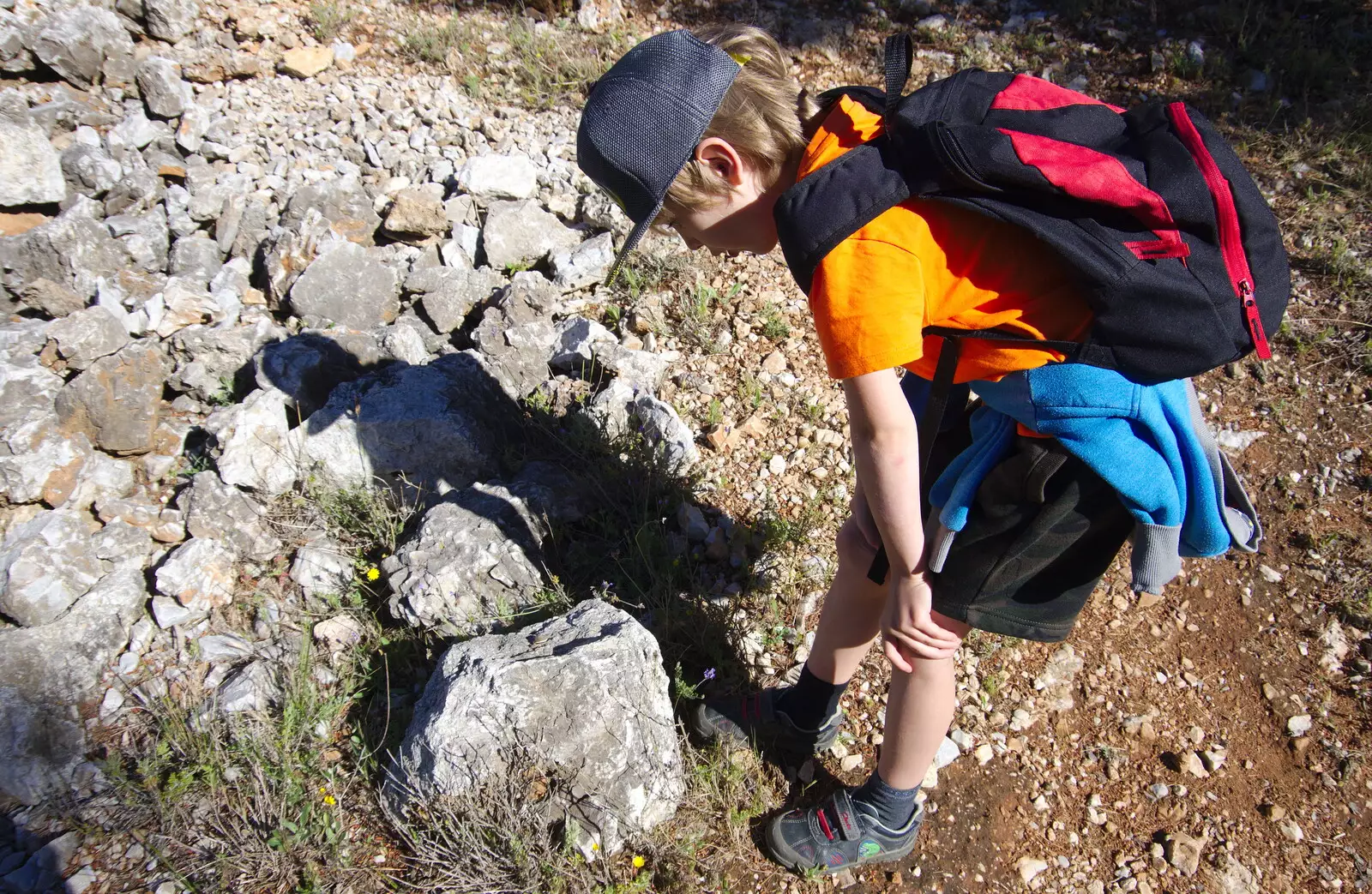 Harry looks at a rock, from A Walk up a Hill, Paella on the Beach and Granada, Andalusia, Spain - 19th April 2018