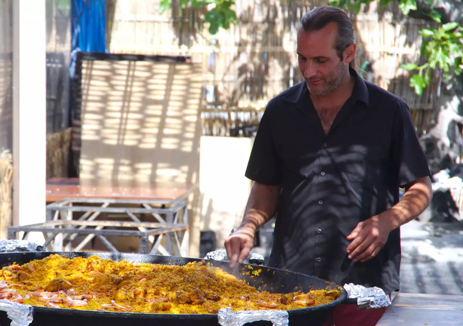 The dude tends to his paella, from A Walk up a Hill, Paella on the Beach and Granada, Andalusia, Spain - 19th April 2018