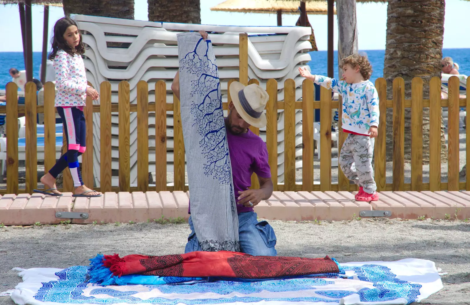 One of the omnipresent rug dudes sets up his pitch, from A Walk up a Hill, Paella on the Beach and Granada, Andalusia, Spain - 19th April 2018