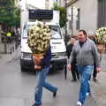 Some dudes rush past with big flower bushes in pots, A Walk up a Hill, Paella on the Beach and Granada, Andalusia, Spain - 19th April 2018