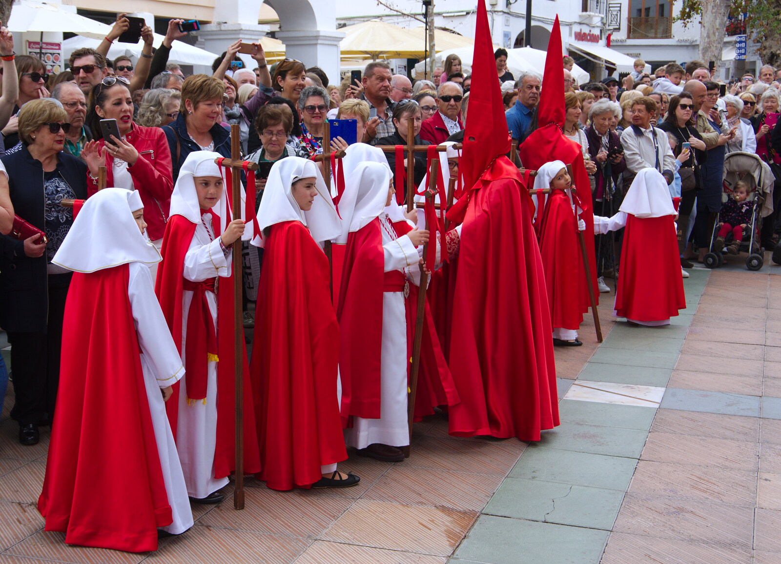 The pointy hats, or Capirotes, represent penitence from An Easter Parade, Nerja, Andalusia, Spain - 21st April 2019