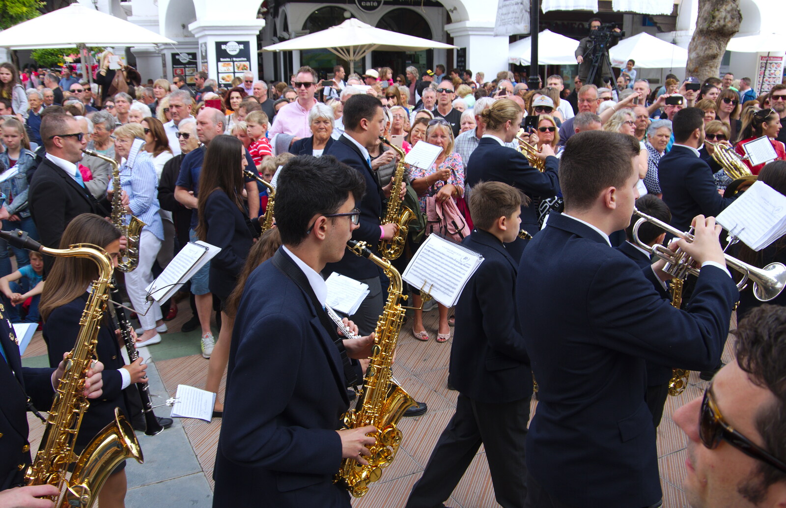The saxophone section of another band marches past from An Easter Parade, Nerja, Andalusia, Spain - 21st April 2019