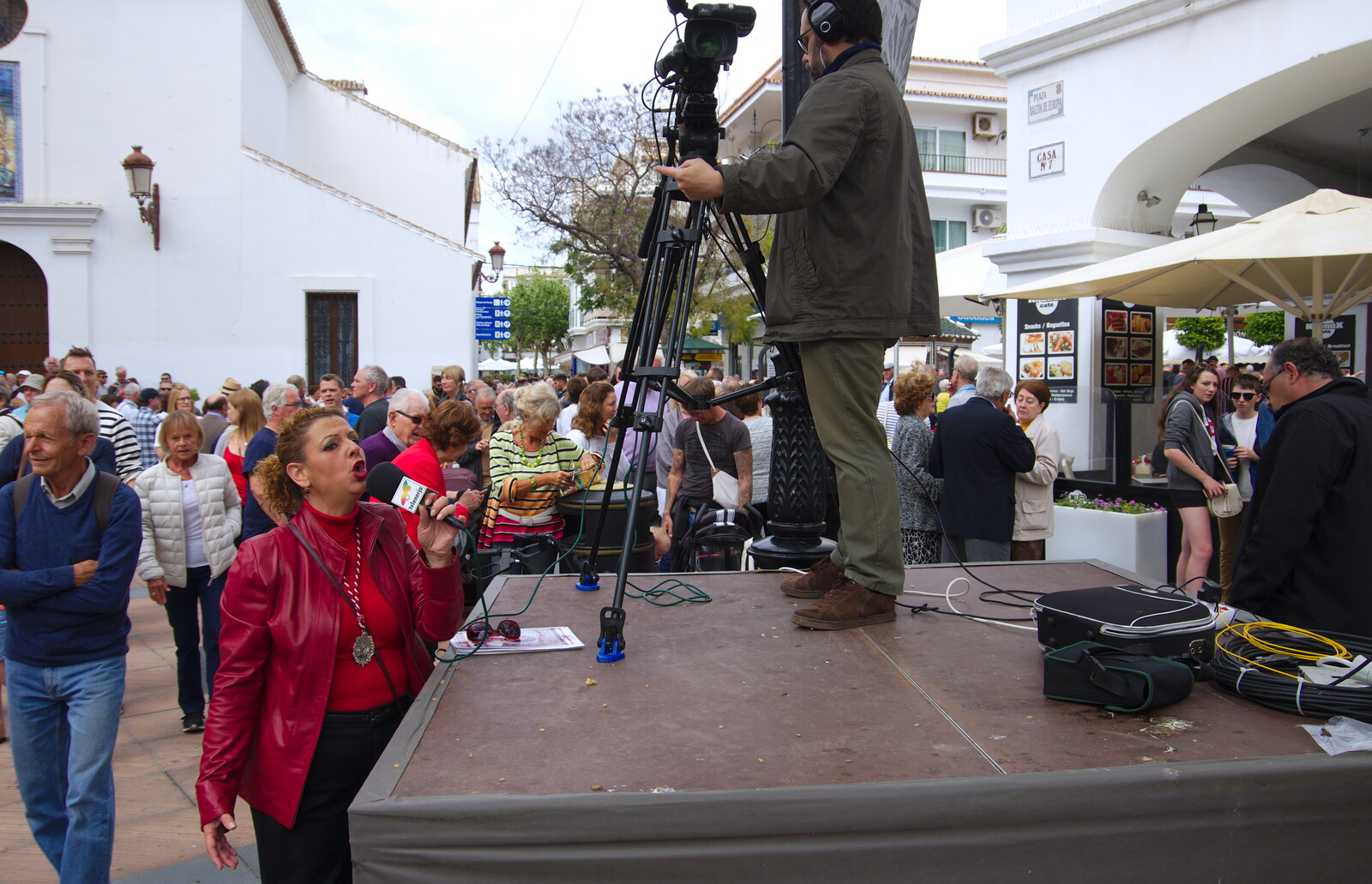 A TV presenter does her thing from An Easter Parade, Nerja, Andalusia, Spain - 21st April 2019