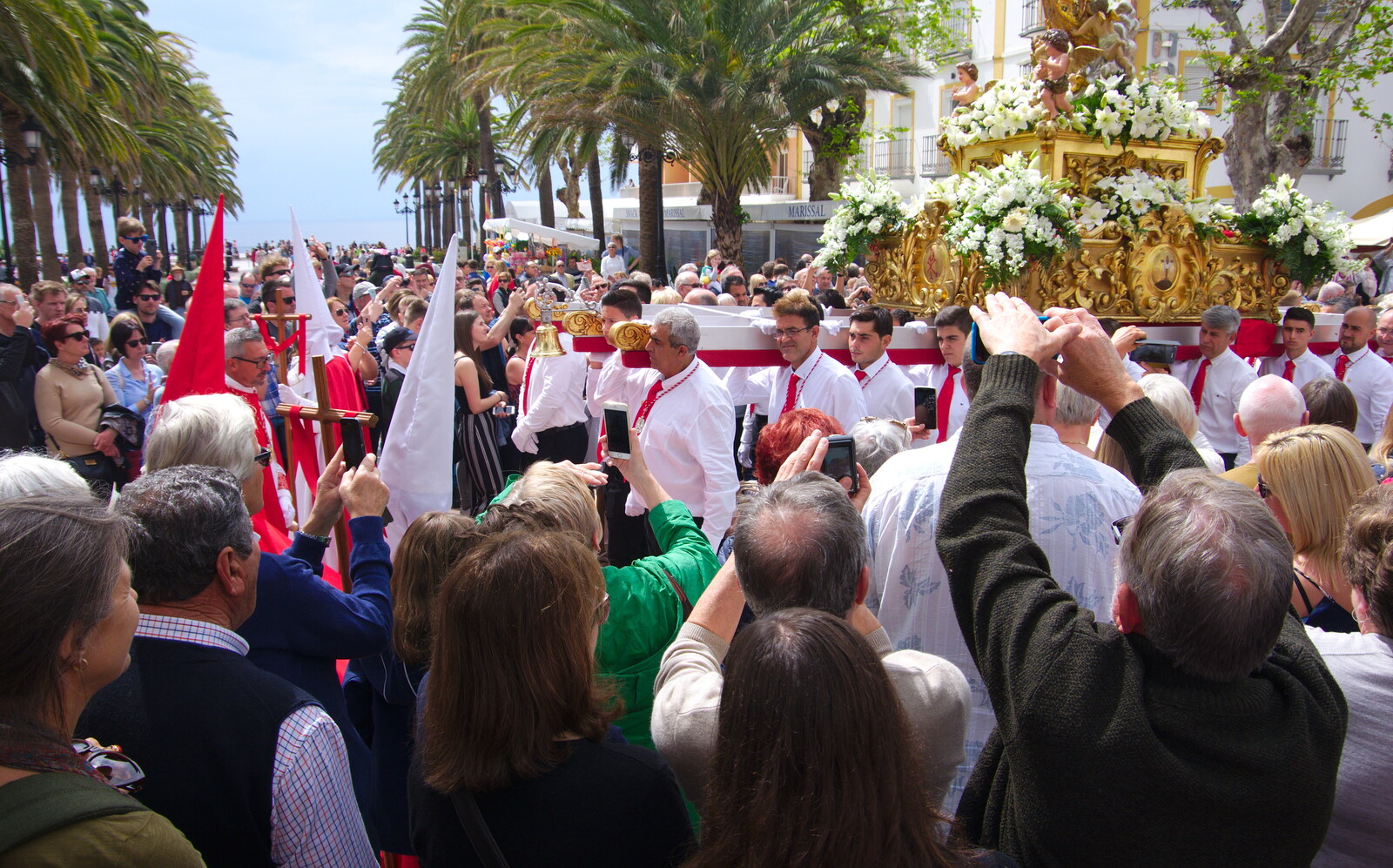 Capirotes and statues head past the Balcón from An Easter Parade, Nerja, Andalusia, Spain - 21st April 2019