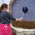 Isobel fills up a water bottle, An Easter Parade, Nerja, Andalusia, Spain - 21st April 2019
