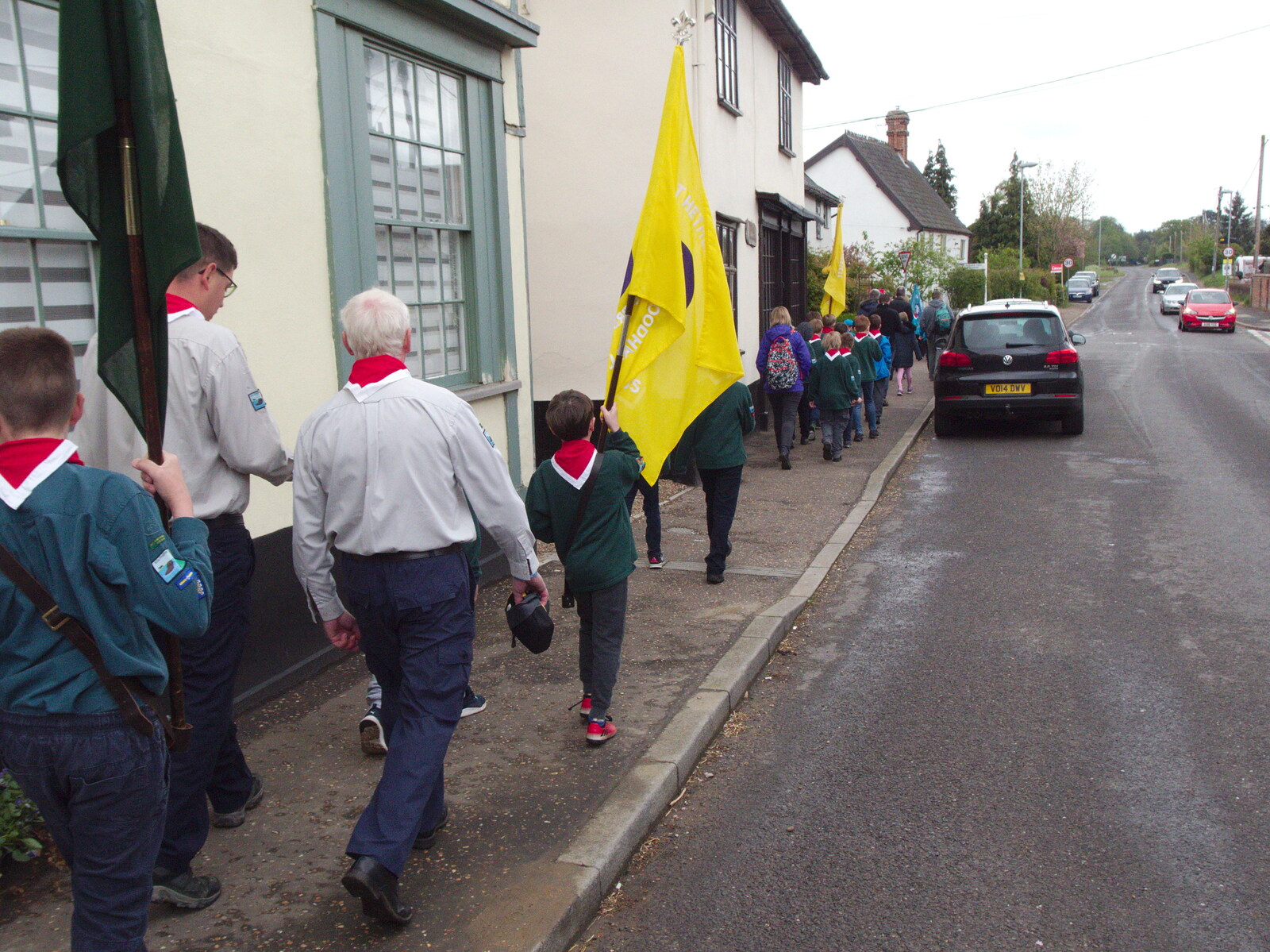 The Scouts carry their flags from the Scout hut from A St. George's Day Parade, Dickleburgh, Norfolk - 28th April 2019