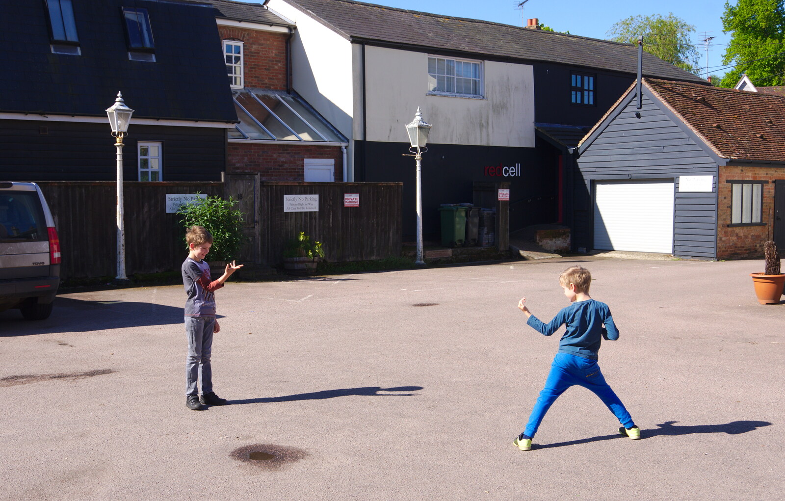 In the car park, Fred and Harry do ninjas from The BSCC Bike Ride 2019, Coggeshall, Essex - 11th May 2019