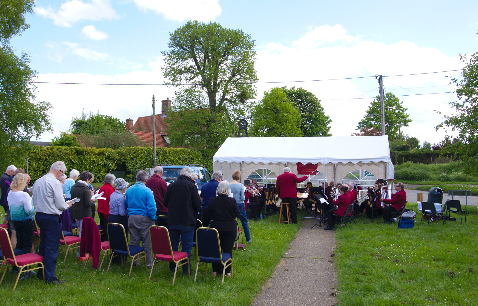 The crowd stands up to sing hymns from The Gislingham Silver Band at the Village Hall, Gislingham, Suffolk - 12th May 2019