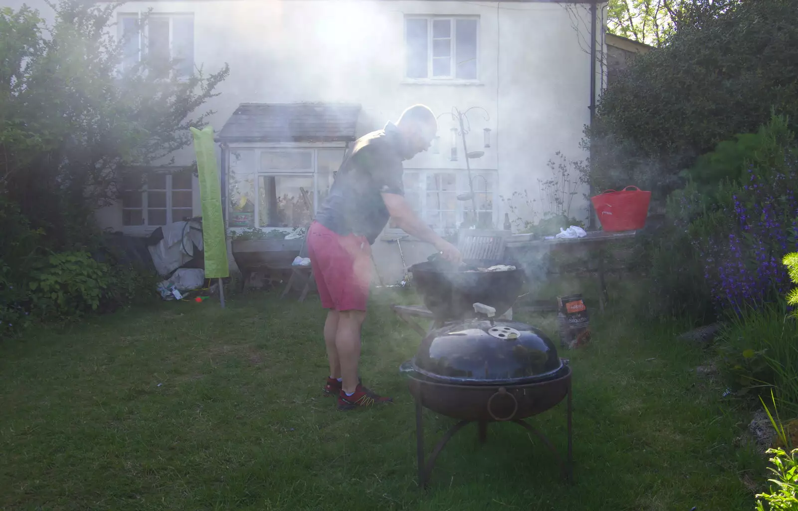 Matt gets the barbeque going, from Chagford Lido and a Trip to Parke, Bovey Tracey, Devon - 25th May 2019