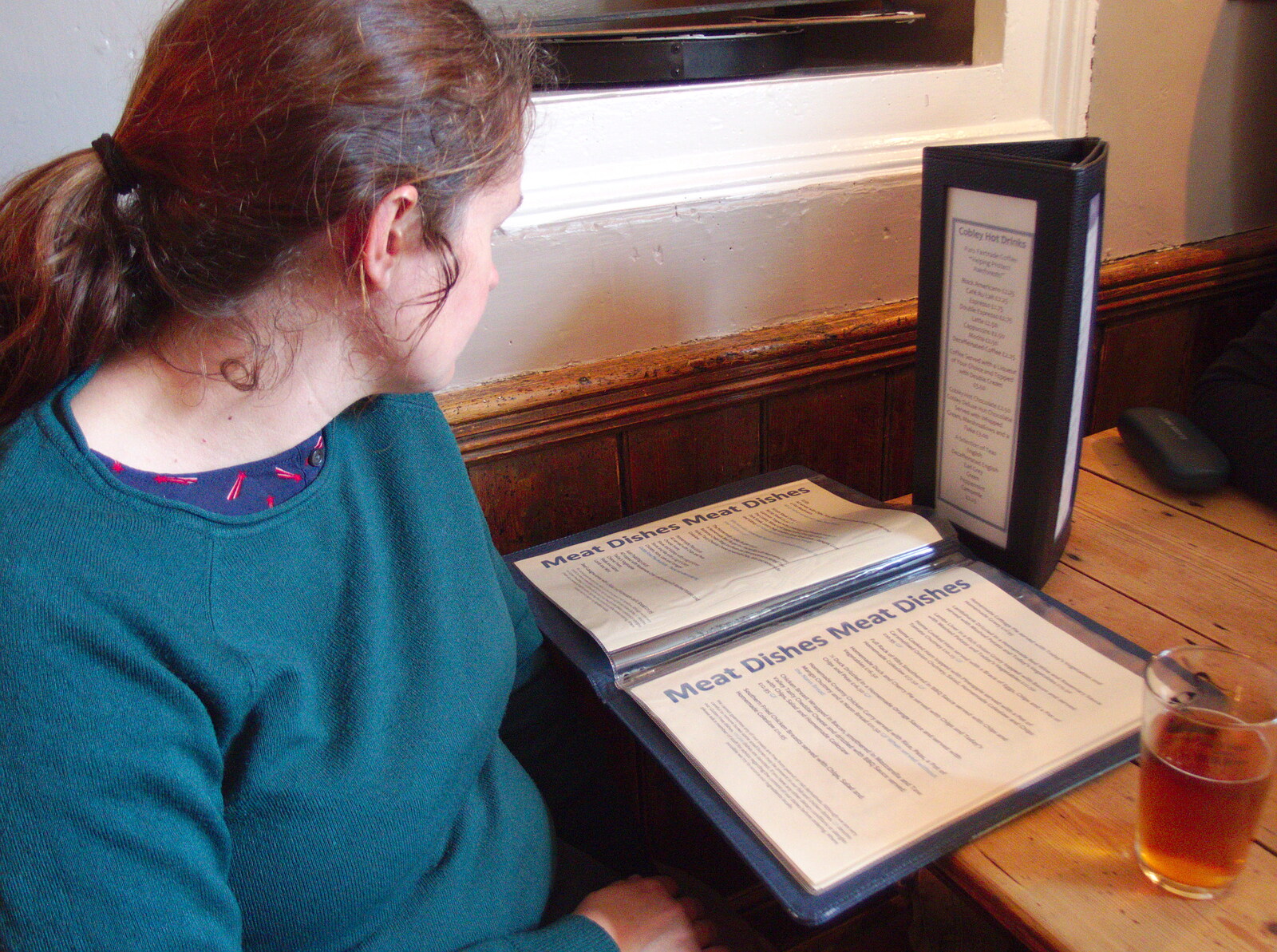 Isobel scopes out the Cobley's menu from The Tom Cobley and a Return to Haytor, Bovey Tracey, Devon - 27th May 2019