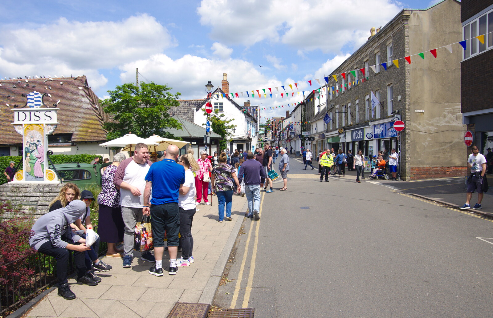 People mill around by the town sign from The Diss Carnival 2019, Diss, Norfolk - 9th June 2019
