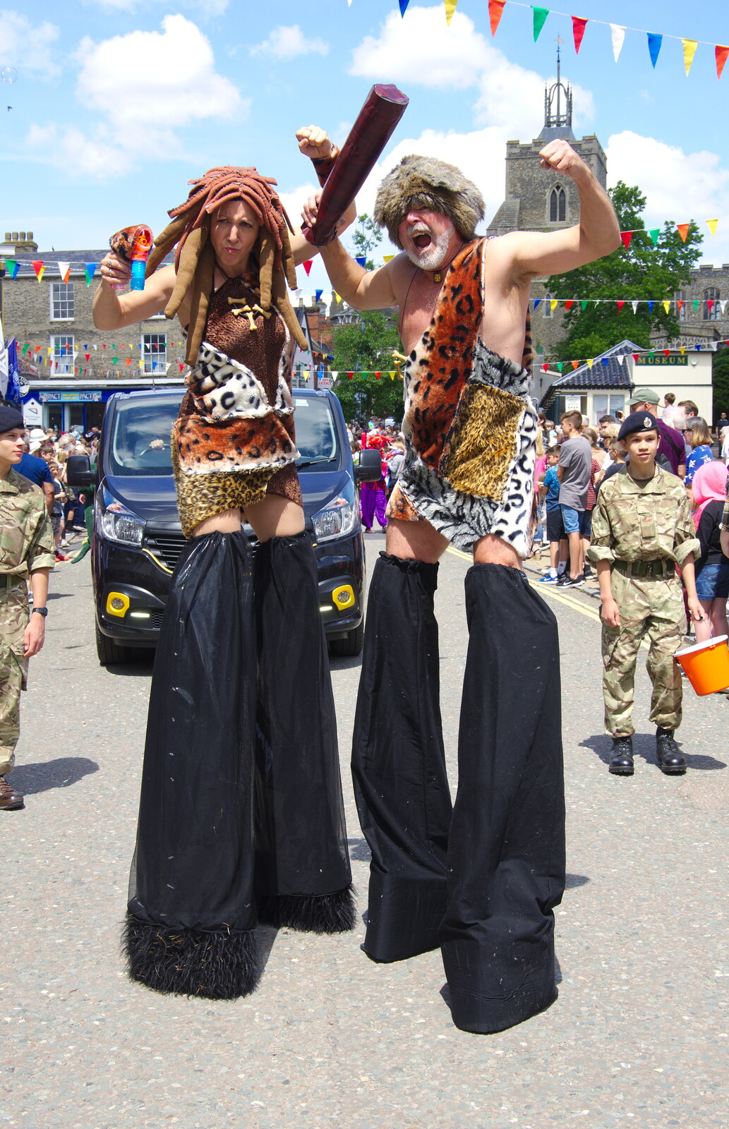 A couple of cave-people in stilts from The Diss Carnival 2019, Diss, Norfolk - 9th June 2019