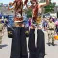 A couple of cave-people in stilts, The Diss Carnival 2019, Diss, Norfolk - 9th June 2019