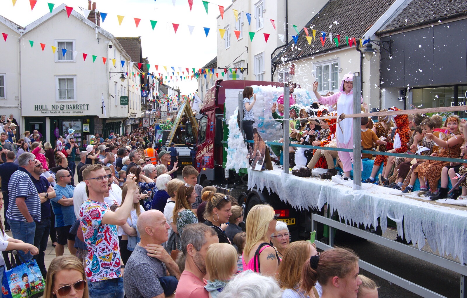 The foam float moves along towards Mere Street from The Diss Carnival 2019, Diss, Norfolk - 9th June 2019