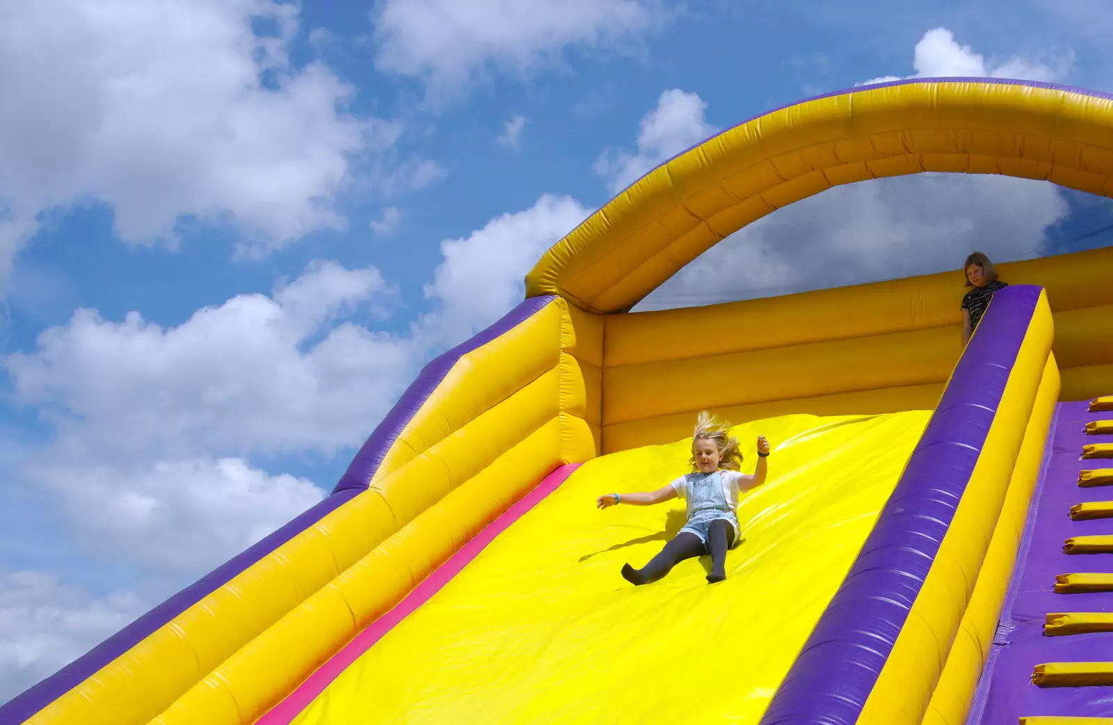 Alice is all hair as she hurtles down the slide, from The Diss Carnival 2019, Diss, Norfolk - 9th June 2019